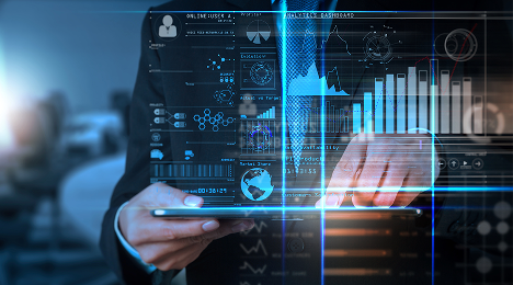 mid section close up of business man in a suit holding a tablet, financial diagrams supper imposed on image