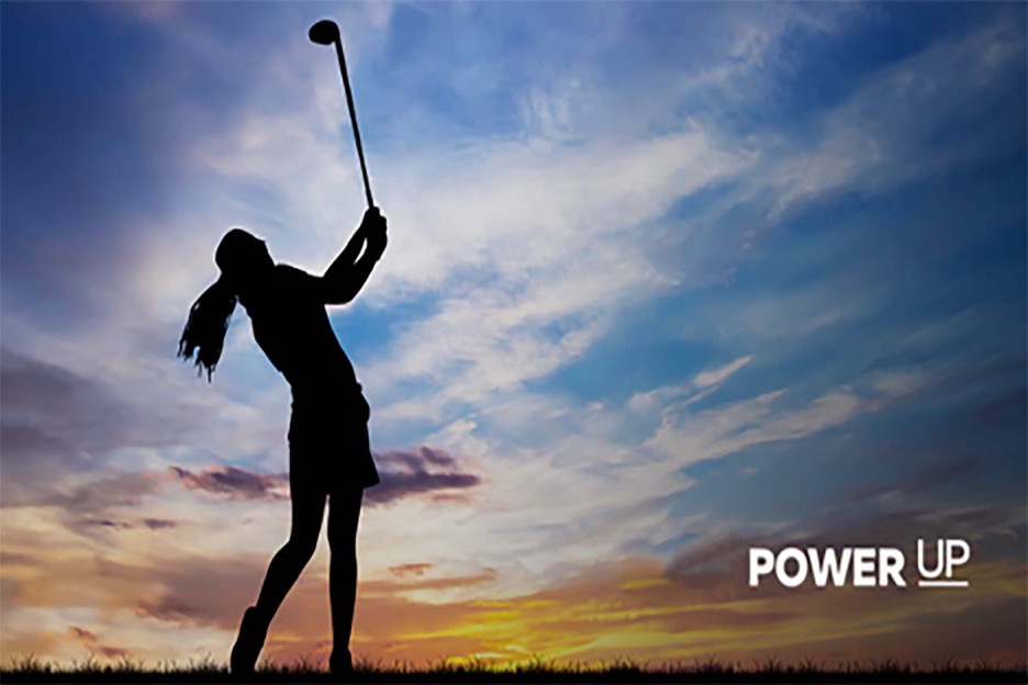 Power up silhouette of female golfer at dawn