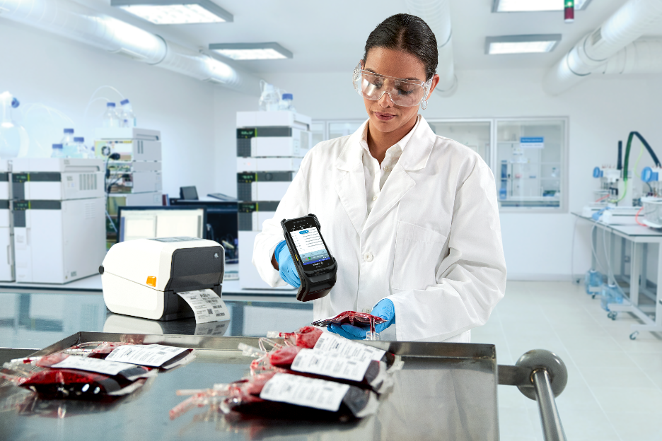 Female lab technician using a hand held scanner