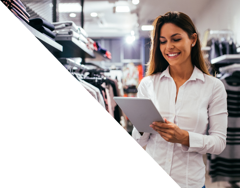 Retail worker checking inventory on a tablet.