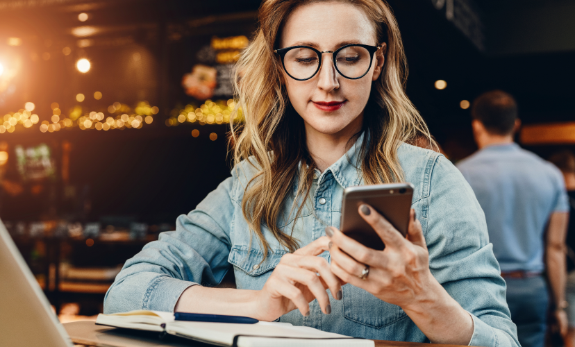 Young woman checking her email marketing on her mobile phone